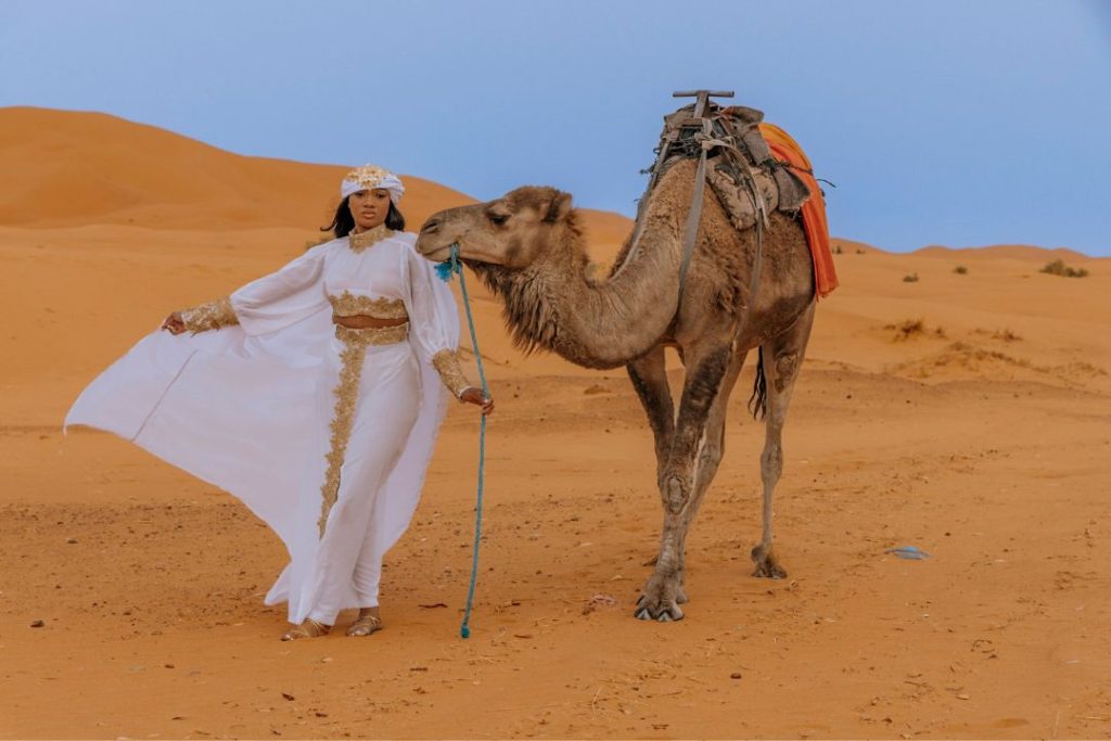 women with camel in Merzouga desert